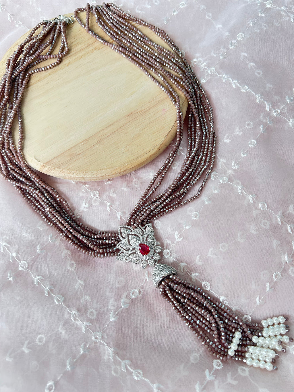 Adaa Necklace alternate view 3 showing hydro stones, a white metal pendant and red stone.