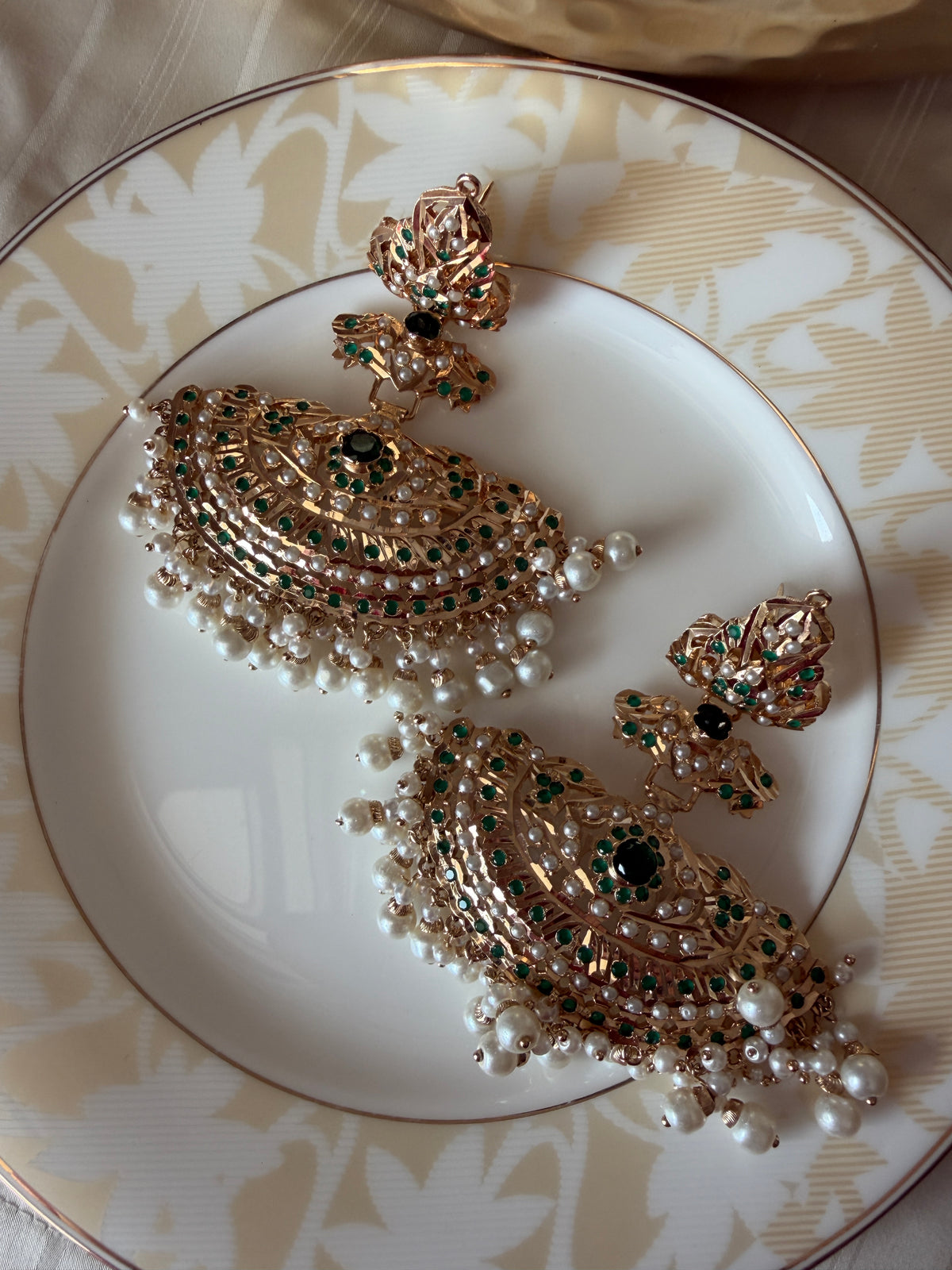 Khwahish Earrings close-up showing jadau detailing and semi-precious stonework.