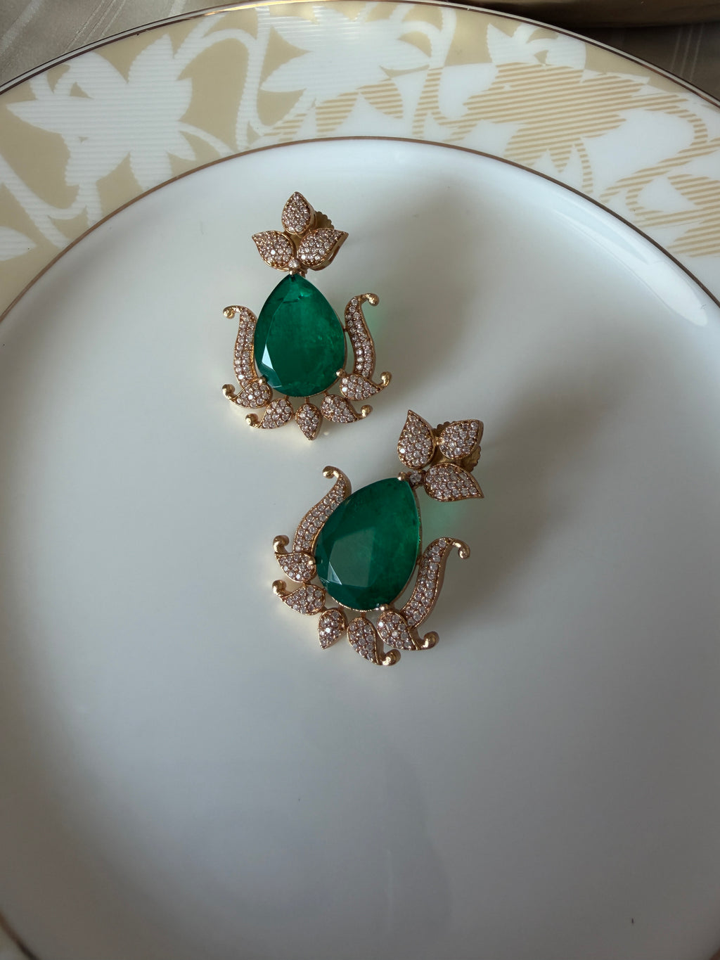 Gul Earrings by KINAHH with double green stones and American diamond accents in brass.