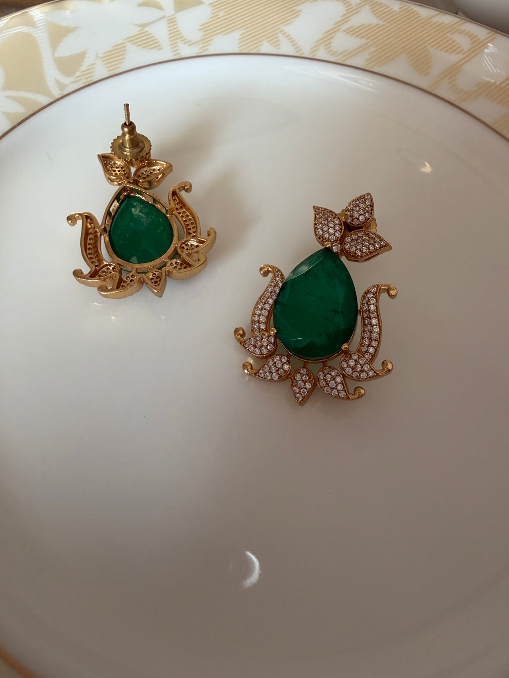 Gul Earrings alternate angle showing brass frame and green stone design.