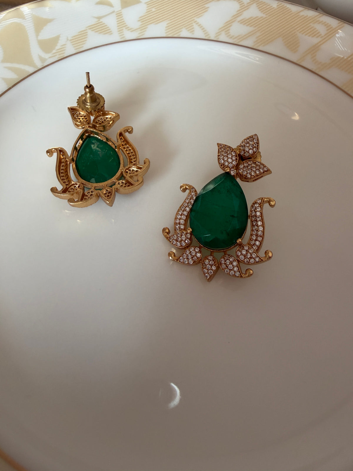 Gul Earrings alternate angle showing brass frame and green stone design.