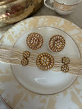 Renuka ivory pearl choker necklace set with gold-tone clear-stone motifs and matching stud earrings