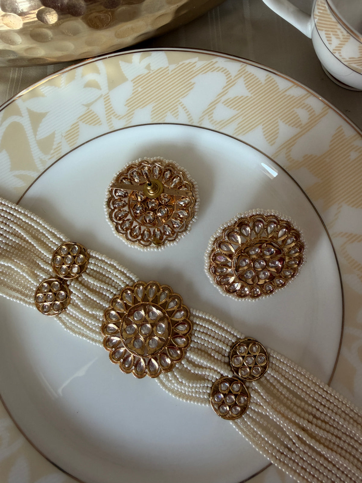 Renuka necklace set with front and rear views of the matching statement stud earrings