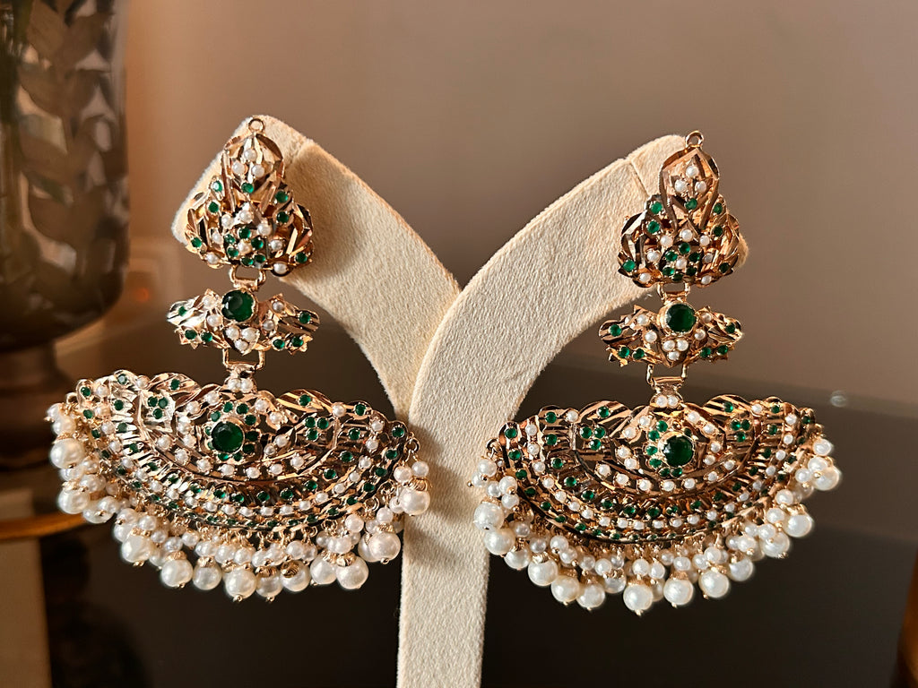 Close-up of the Khwahish earring pair, highlighting green and pink stonework, gold-tone detailing and rows of pearl-like drops.