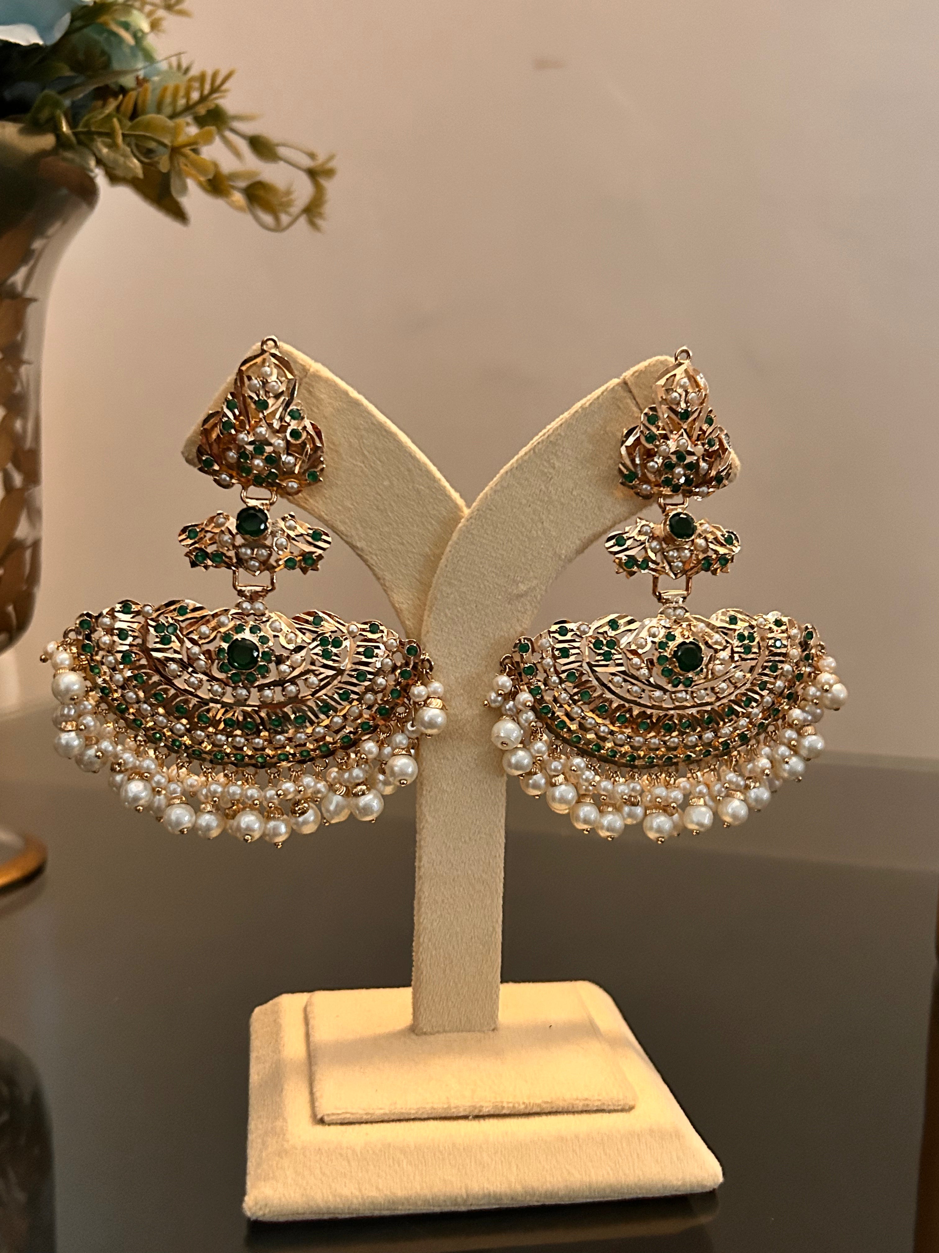 Alternate full-stand view of Khwahish green and pink stone earrings with gold-tone details and pearl-like drops.