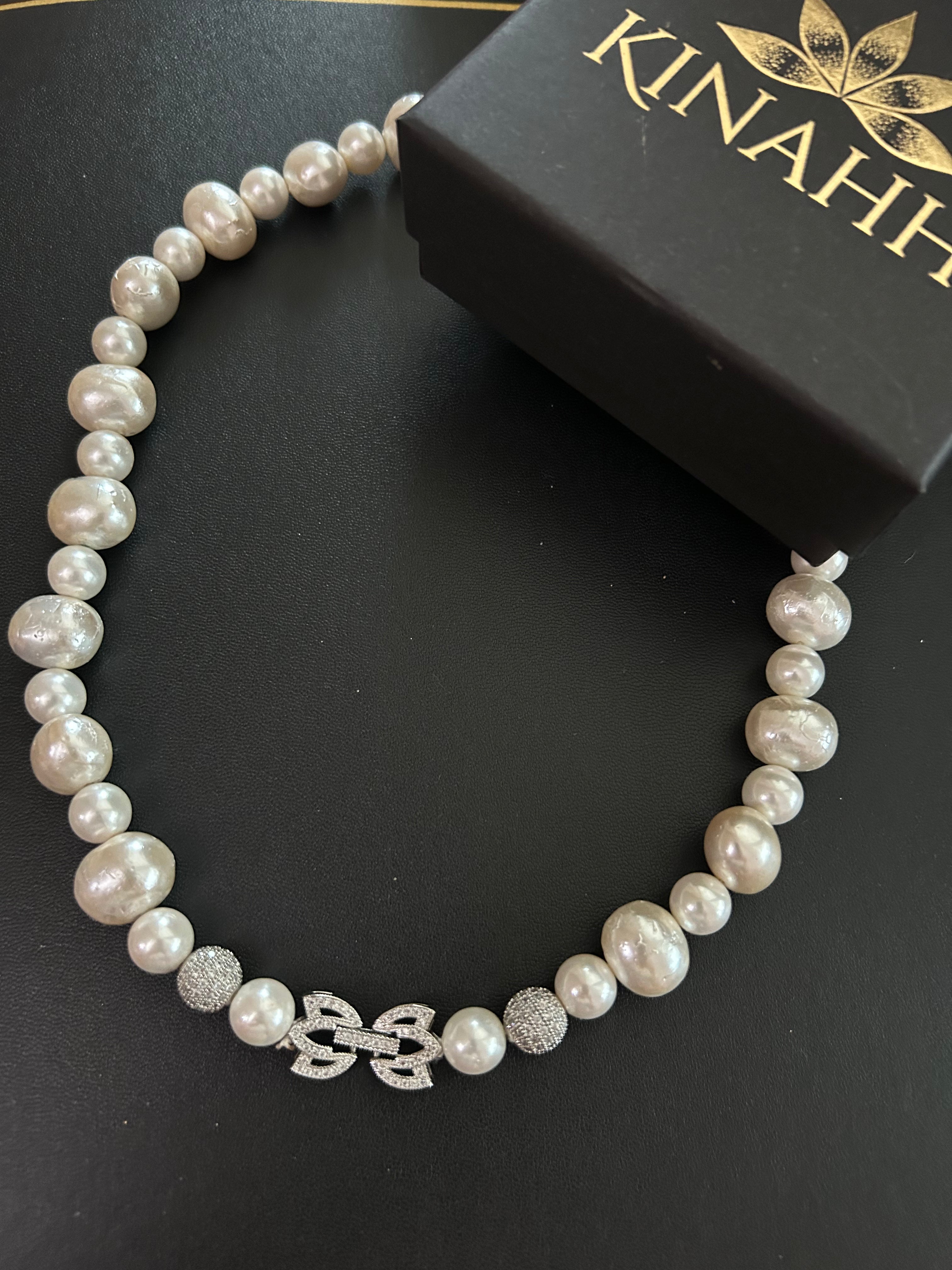 Mehr Necklace detail view showing white shell pearls and an anti-tarnish white metal lock.