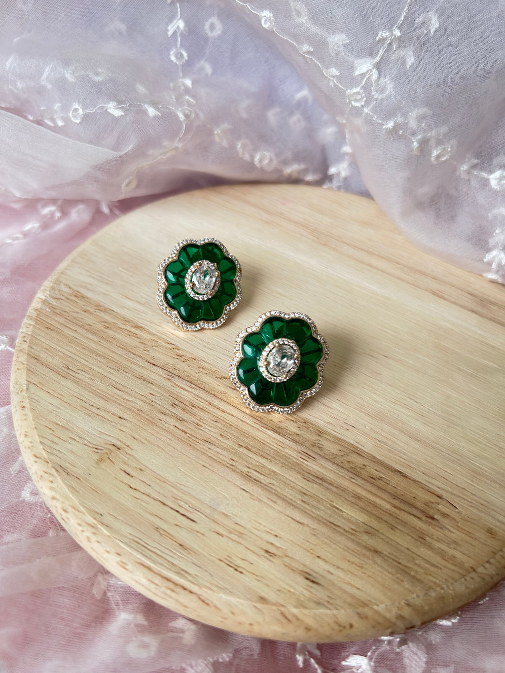 Ruh Earrings by KINAHH with American diamonds and green stones in brass.