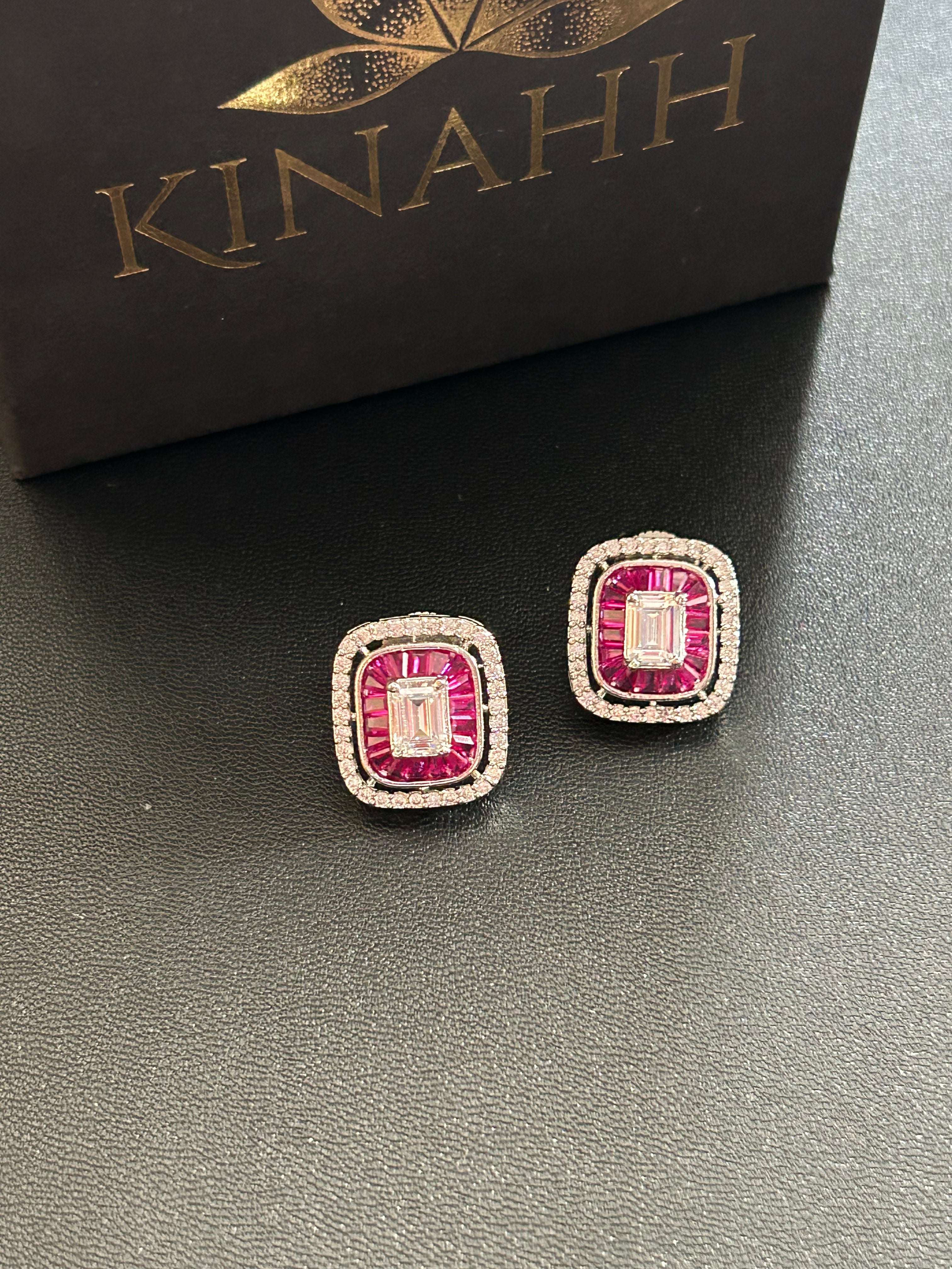 SIA Earrings by KINAHH with American diamonds, red stones and rhodium plating.