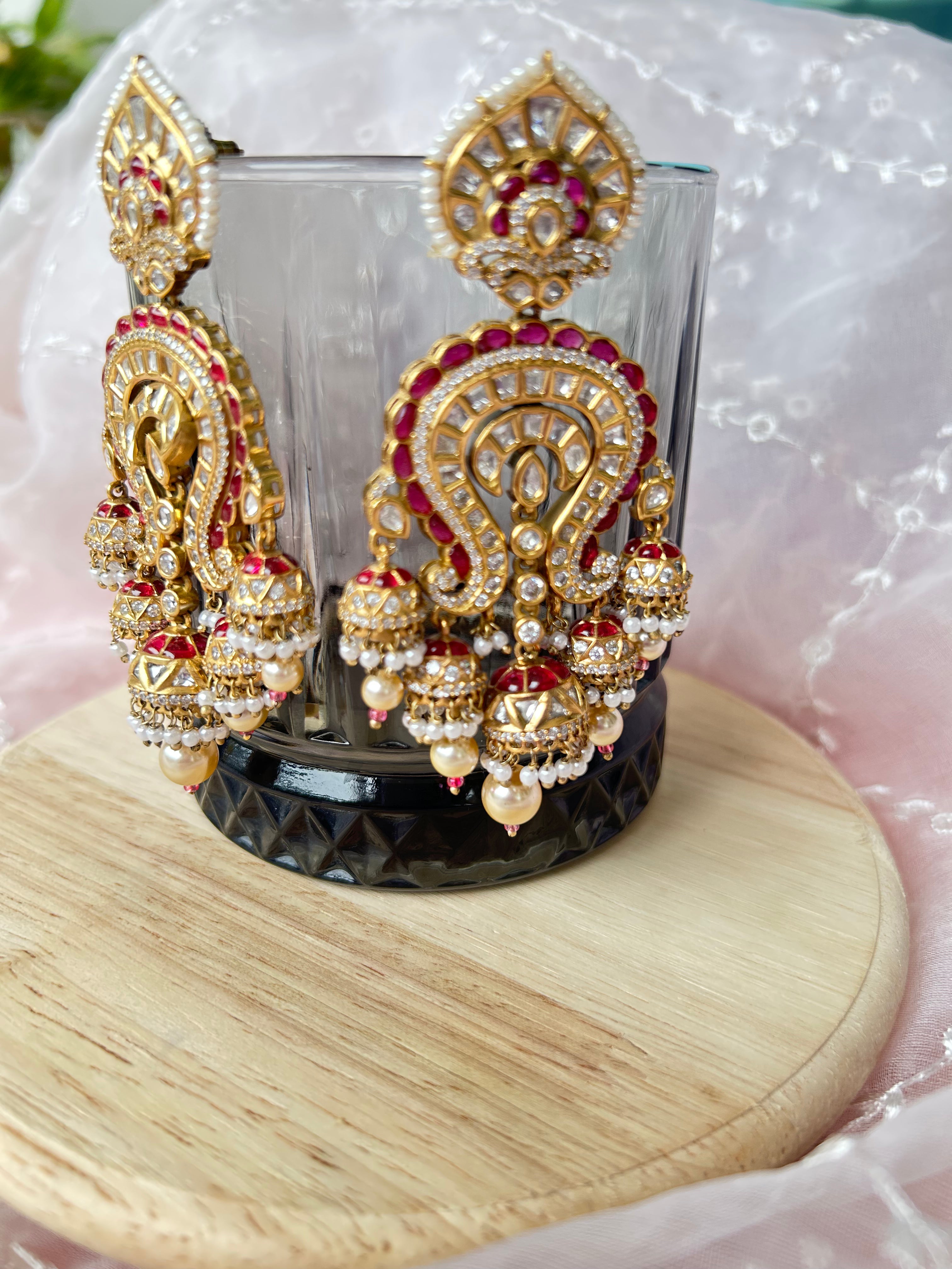 Saanjh Earrings alternate view 3 showing moissanite polki and red stones in brass.