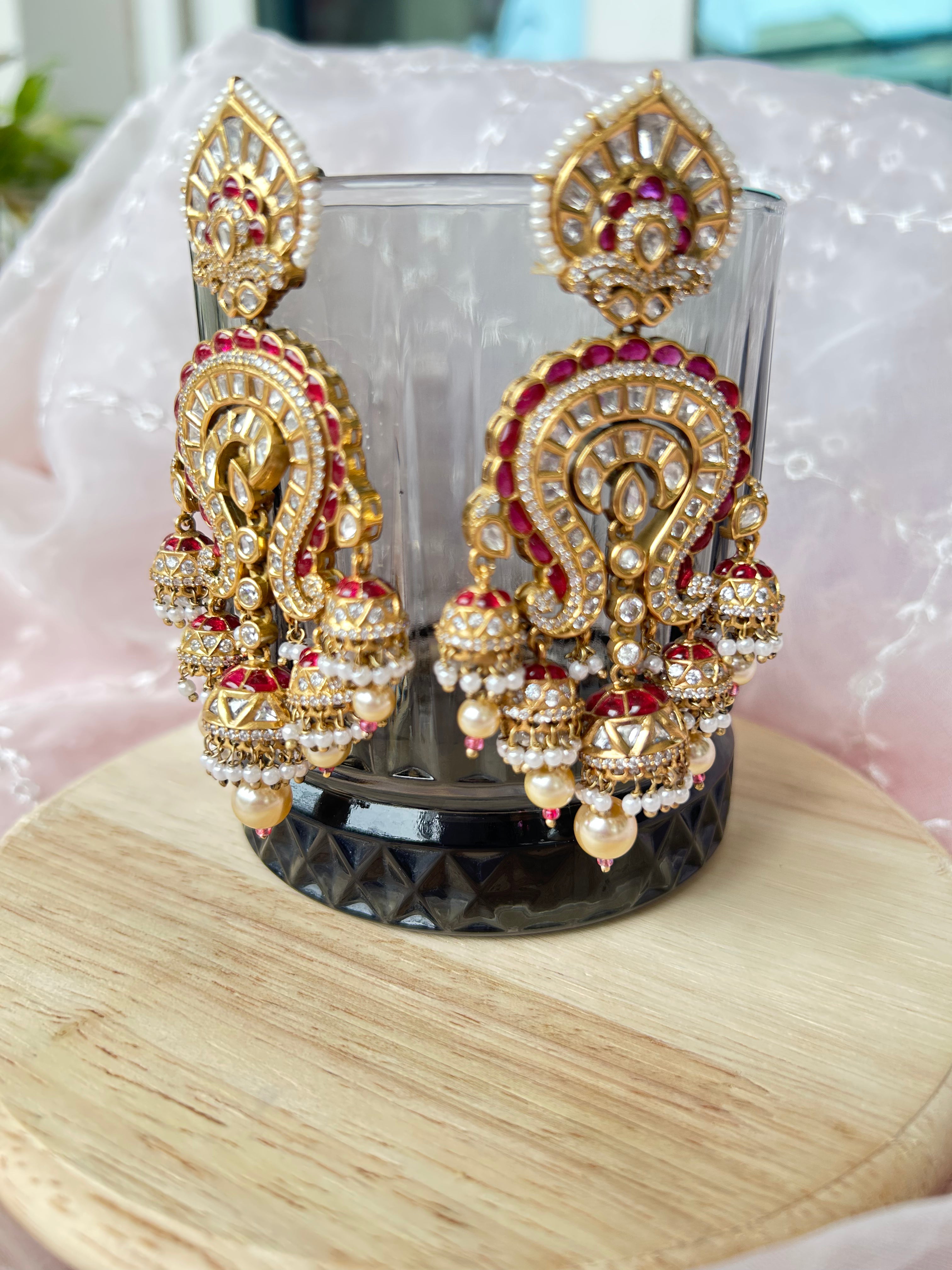 Saanjh Earrings alternate view 4 showing moissanite polki and red stones in brass.