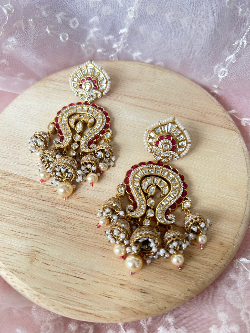 Saanjh Earrings alternate view 5 showing moissanite polki and red stones in brass.