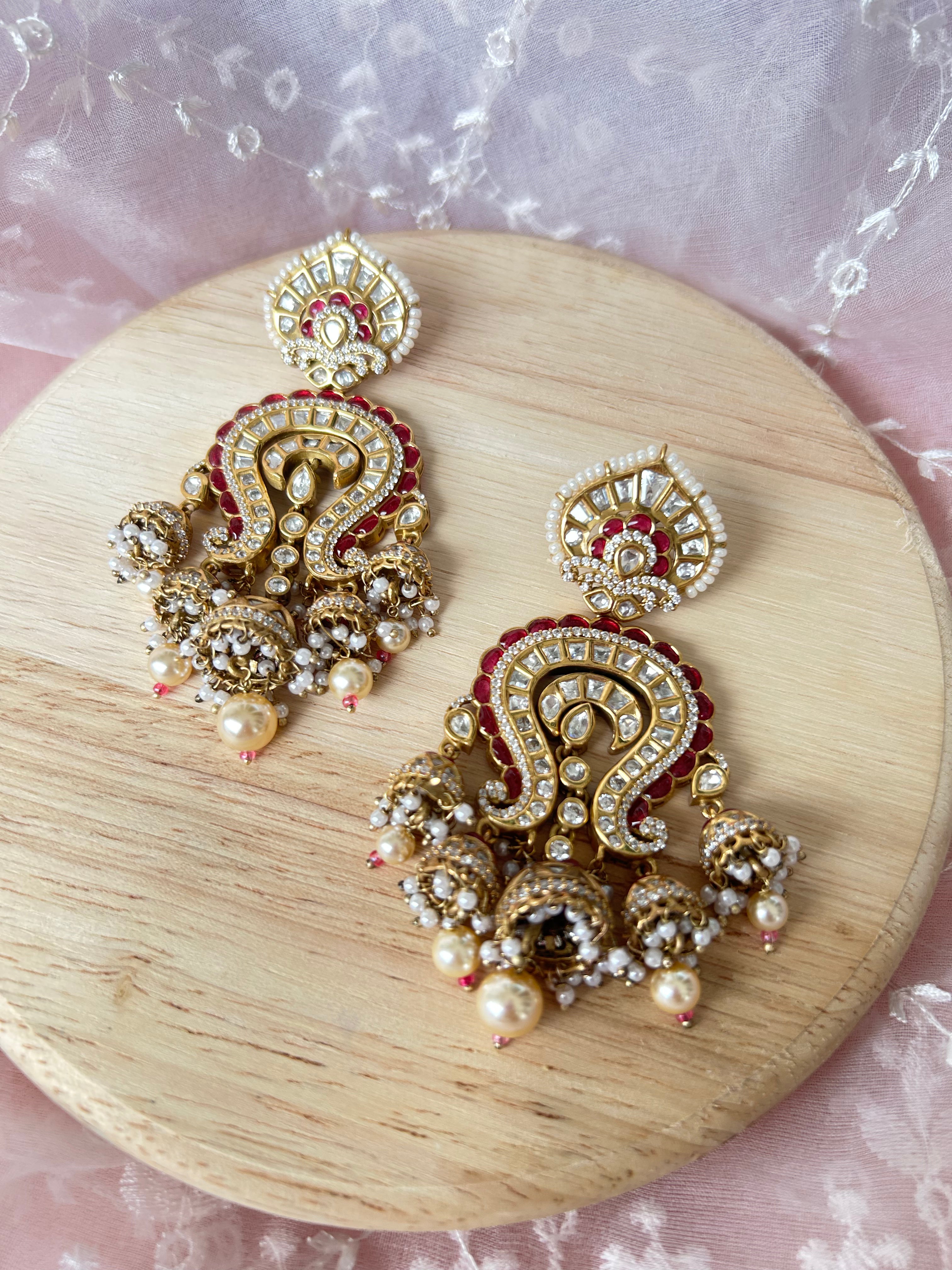 Saanjh Earrings alternate view 5 showing moissanite polki and red stones in brass.