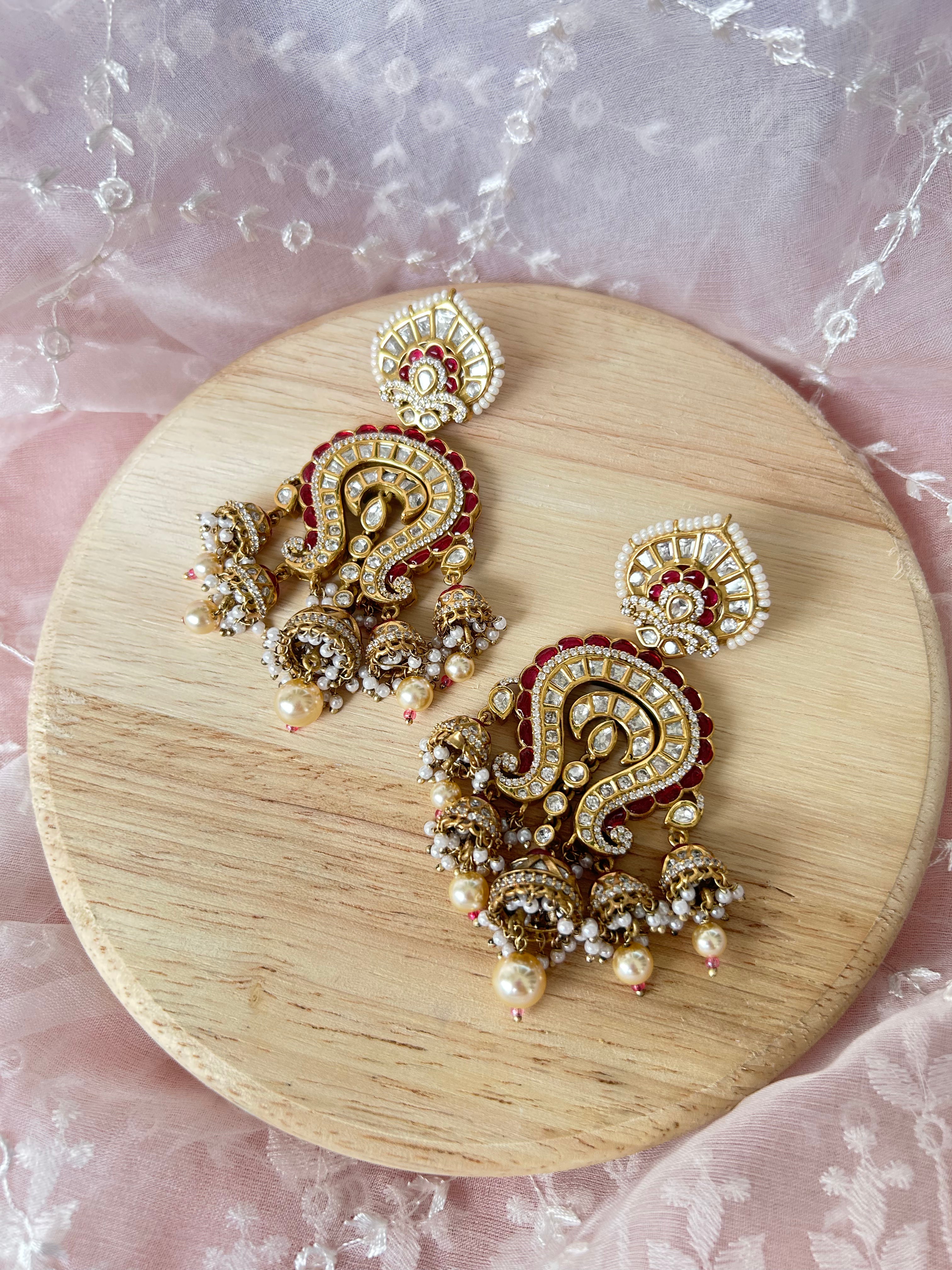 Saanjh Earrings alternate view 6 showing moissanite polki and red stones in brass.
