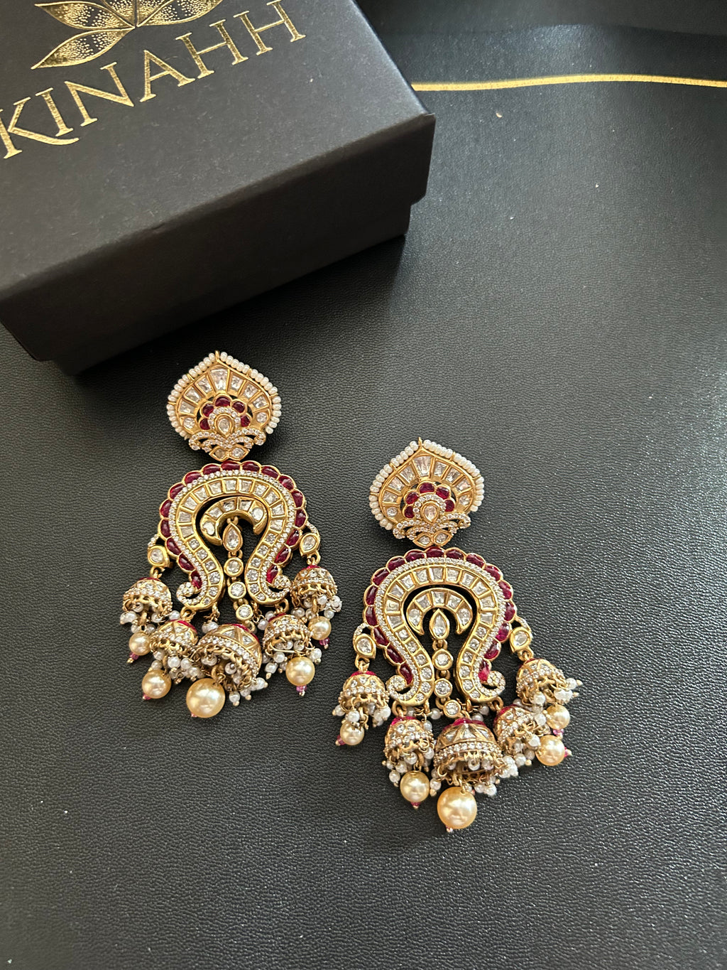 Saanjh Earrings alternate view 8 showing moissanite polki and red stones in brass.