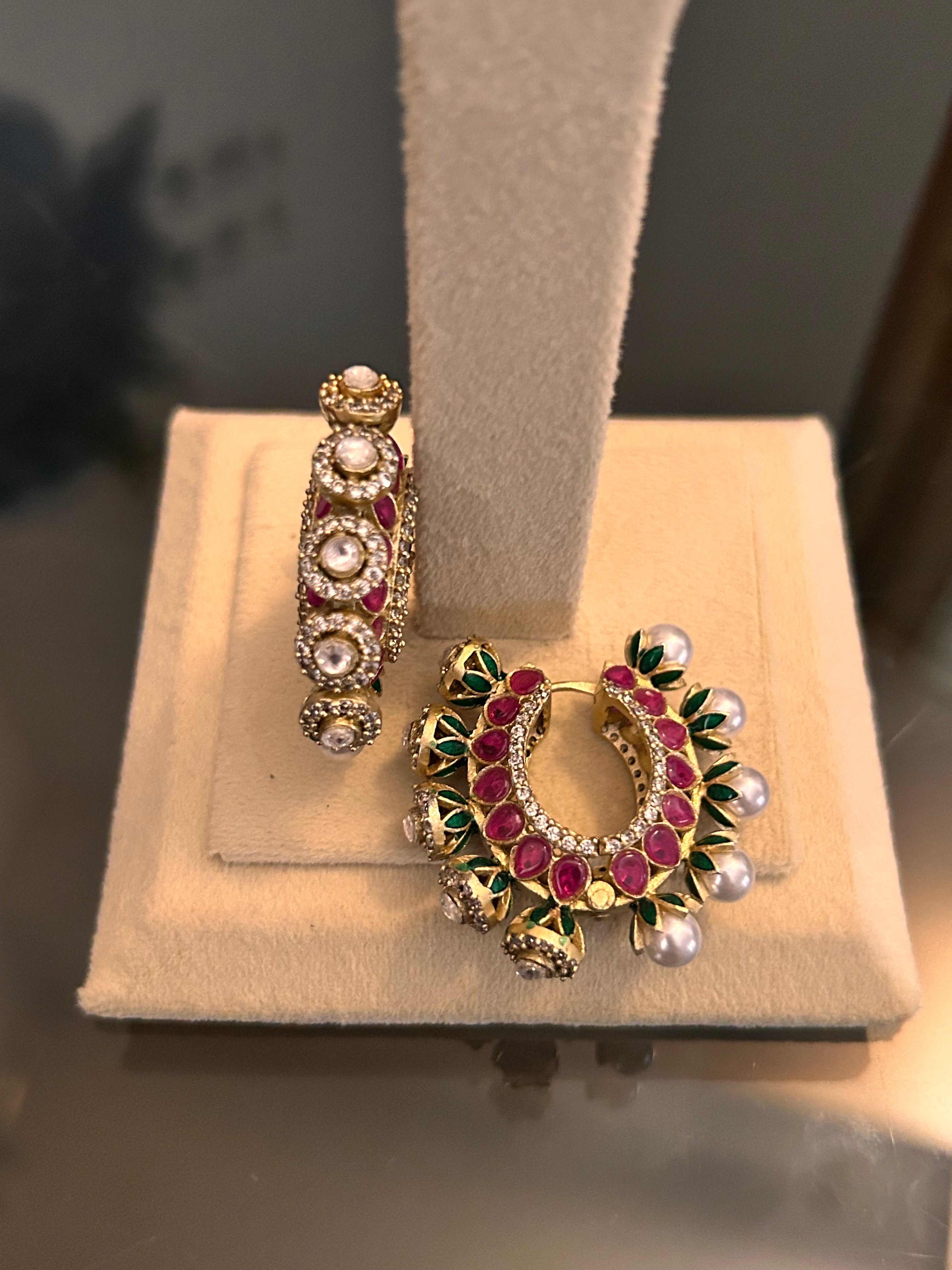 Gulnaar Hoops shown from front and side on a cream stand base, highlighting both decorated faces.